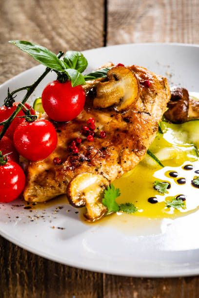 istock Grilled chicken fillet with vegetable salad 1179385436