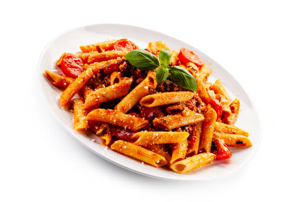 istock Penne with meat, tomato sauce and parmesan on white background 1179386502