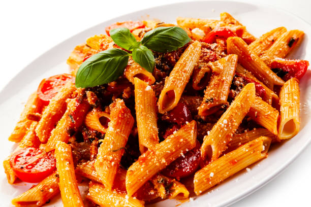 istock Penne with meat, tomato sauce and parmesan on white background 1179386643