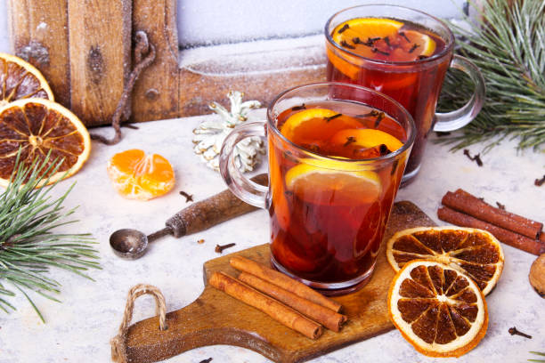 istock Christmas drink, mulled wine with orange, cinnamon and cloves on white background 1179390041