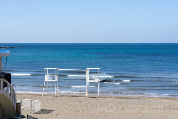 istock White lifeguard Chairs at the Iho Tewoo Beach, Korea 1179390064