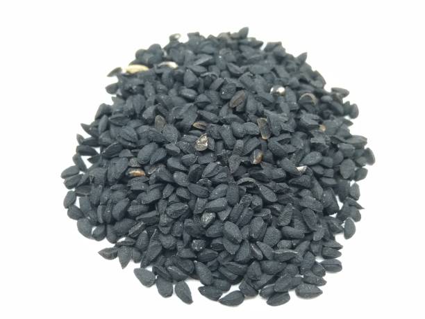istock A picture of black seeds on white background 1179390571