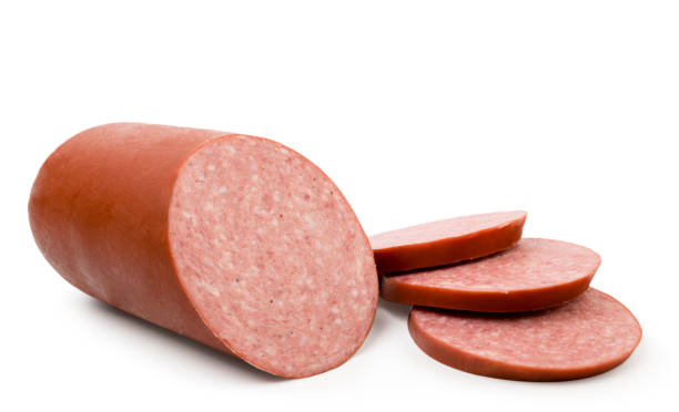istock Sausage and sausage slices on white background. 1179399690
