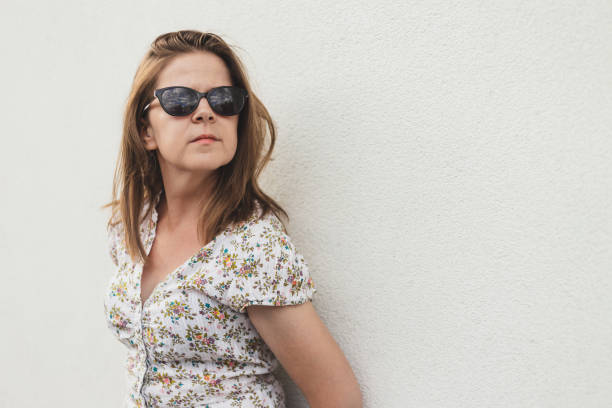 istock Woman leaning against wall 1179401364
