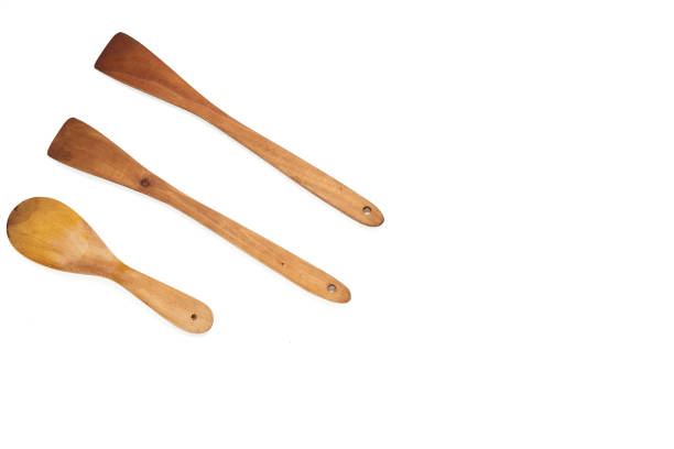 istock flat lay wood Wooden spoon isolated on white background 1179403285