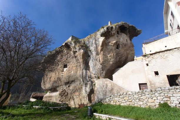 a house built inside a rock in Sedini Sedini, Italy - December 31, 2018: a house built inside a rock in Sedini, Sardinia, Italy castelsardo photos stock pictures, royalty-free photos & images