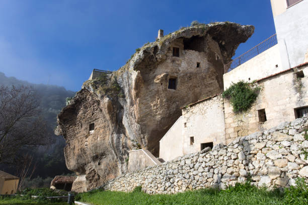 a house built inside a rock in Sedini Sedini, Italy - December 31, 2018: a house built inside a rock in Sedini, Sardinia, Italy castelsardo stock pictures, royalty-free photos & images