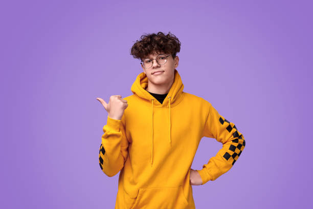 istock Confident teenager pointing aside 1179404604