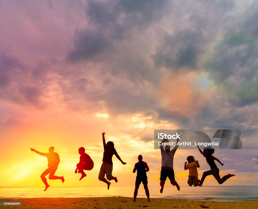 Silhouette Happy family people group celebrate jump for good life on weekend concept for win victory, person faith in financial freedom healthy wellness, Great insurance team support retreat together in summer. Family Stock Photo