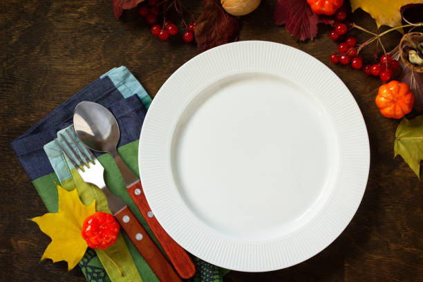 istock Autumn rustic table. Thanksgiving or autumn harvest table setting with rustic silver on a wooden table. Top view of a flat lay. Free space for your text. 1179406243