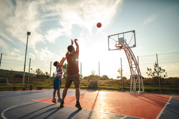 istock Showing his son how to shoot 1179406369