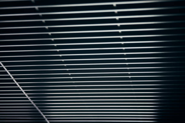 istock Office grille ceiling. Modern black metal grille ceiling, suspended covering. Abstract design texture. 1179407123