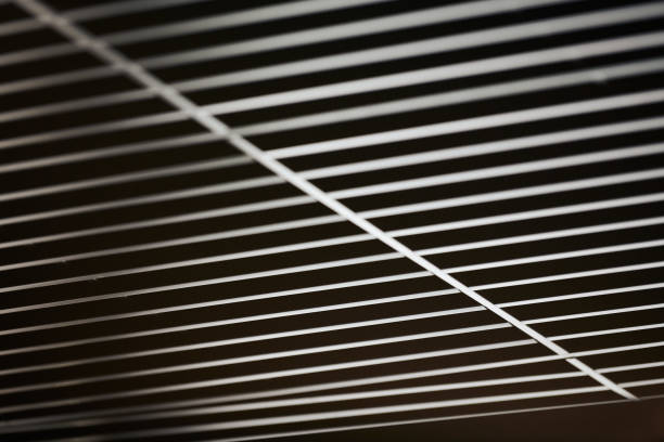 istock Office grille ceiling. Modern black metal grille ceiling, suspended covering. Abstract design texture. 1179407358