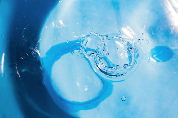 istock Water splash or drop. Water splash close-up. Blue water drop. Falling water 1179408527