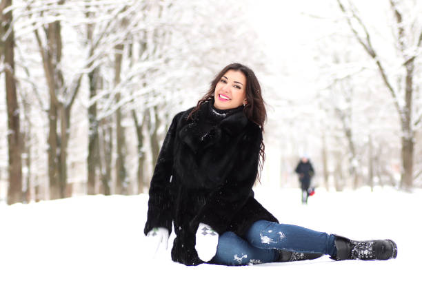 istock A young woman walk in a winter park 1179409873