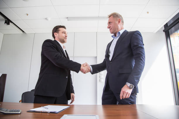 istock Business handshake at meetin table 1179410159