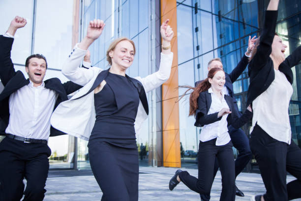 istock Happy running business people 1179410199