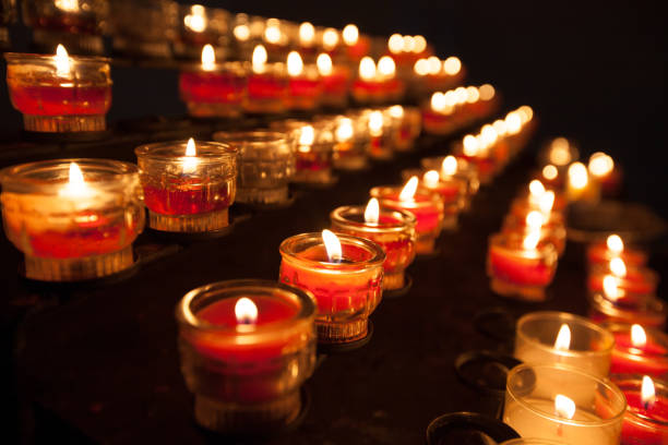 istock Candles in a church 1179412635