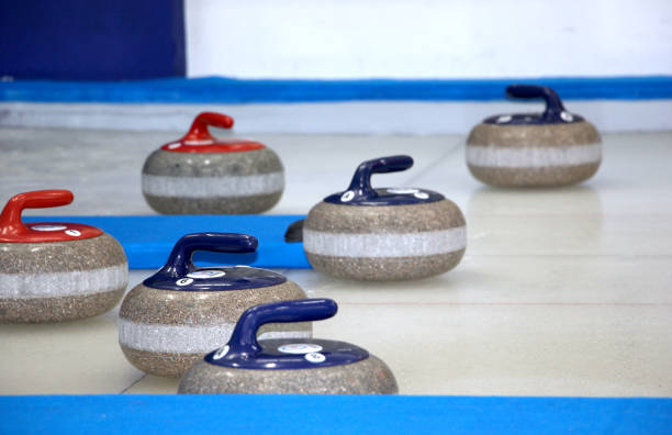 istock Curling stones equipment on the ice 1179412845