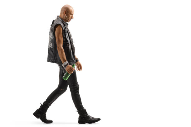 istock Punker walking and holding a bottle of beer 1179413580