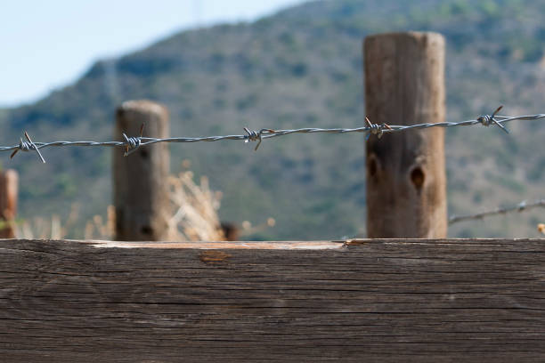 istock Wooden fence with barbed wire 1179414082