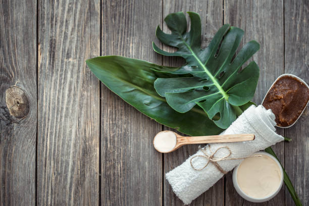 istock Spa composition with towels and tropical leaf on a wooden background. 1179417485
