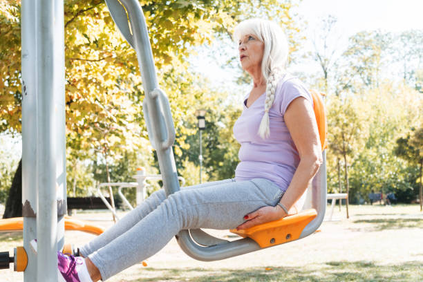 istock Senior woman exercising in park 1179418237