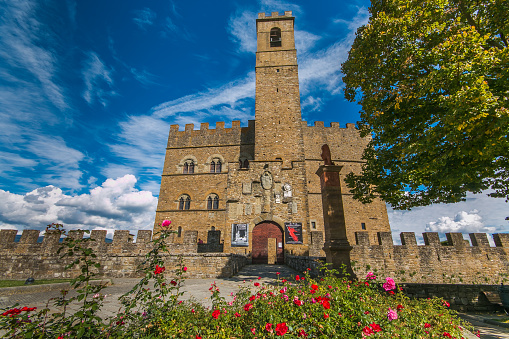 POPPI, ITALY - OCTOBEER 6, 2019: Poppi Castle is an historical icon in the Casentino area. Its imposing structure has weathered the elements well over the centuries and it still stands tall and majestic over one of the most beautiful towns in Italy. It was the Conti Guidi family who built the castle in the XIII century although there is some disagreement between historians over who was responsible for the castle’s design.