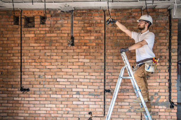 istock Electrician with tools, working on a construction site. Repair and handyman concept. 1179419792