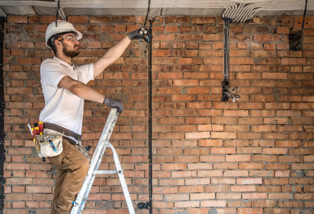 istock Electrician with tools, working on a construction site. Repair and handyman concept. 1179419800