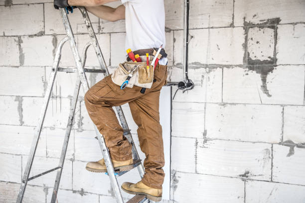 istock Electrician with tools, working on a construction site. Repair and handyman concept. 1179419867