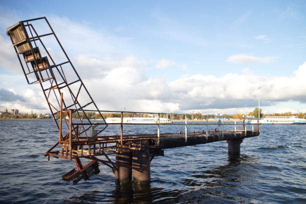 istock Jetty on the river in the city on a sunny day 1179423683