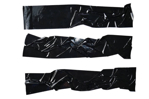 Set of various pieces of black duct tape stock photo