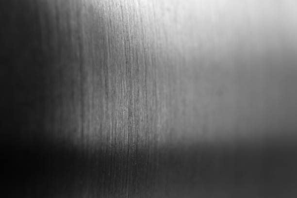 istock Metal macro background. Textured gray aluminum texture with selective focus, close-up 1179423916