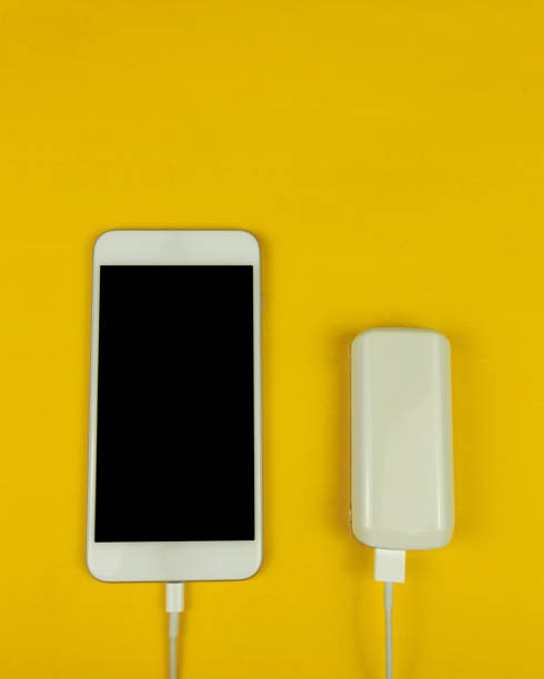 istock Mobile and power bank on the yellow background. Space Text. 1179424015
