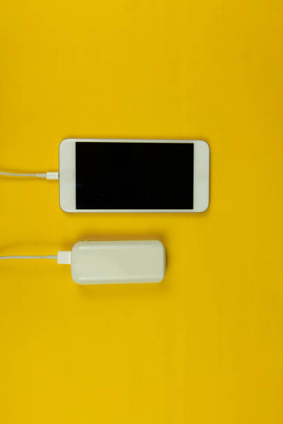 istock Mobile and power bank on the yellow background. Space Text. 1179424021