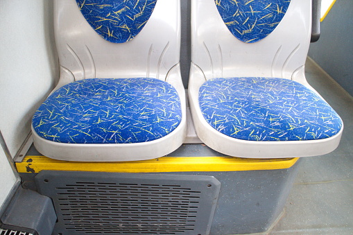 Blue seats in a city bus