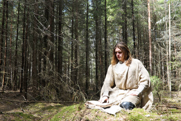 istock A man in a cassock spends a ritual in a dark forest 1179431029