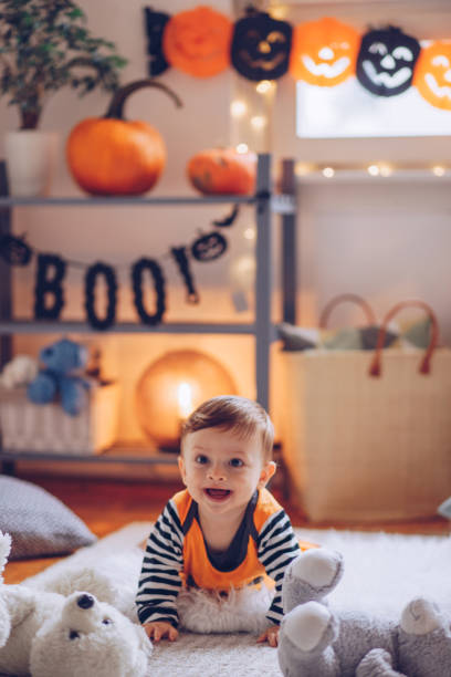 istock Baby in costume crawling on Halloween 1179431081