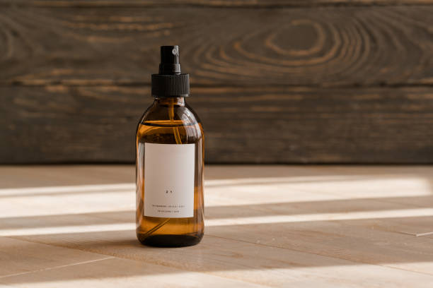 istock Cosmetic dark amber bottles on wooden  table 1179432064