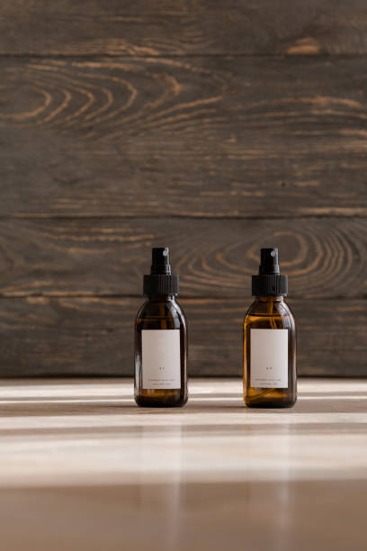 istock Cosmetic dark amber bottles on wooden  table 1179432067