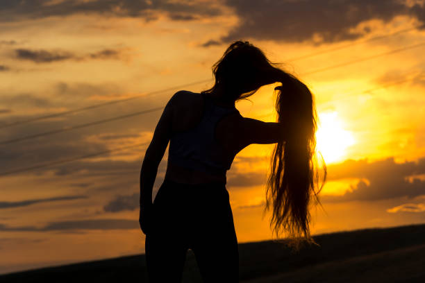 istock Silhouette of woman with sunlight 1179432242