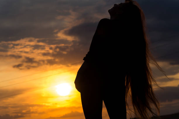 istock Silhouette of woman with sunlight 1179432245