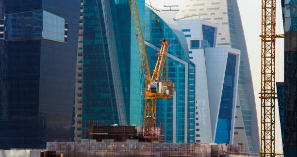 istock big crane and modern buildings, construction industry 1179432302