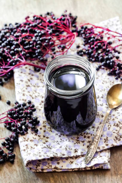 istock Homemade black elderberry syrup in glass jar 1179433663