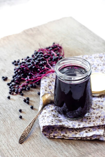 istock Homemade black elderberry syrup in glass jar 1179433721