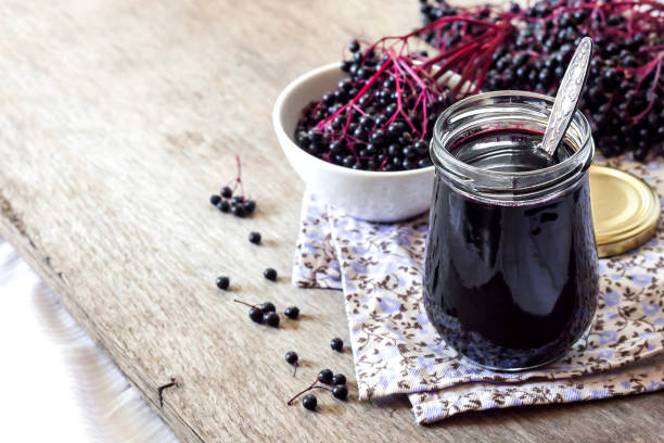 istock Homemade black elderberry syrup in glass jar 1179433872