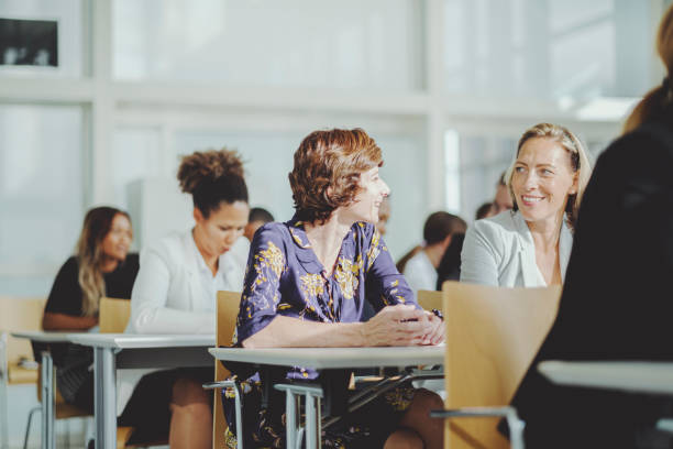 istock Women talking in seminar classroom 1179434466