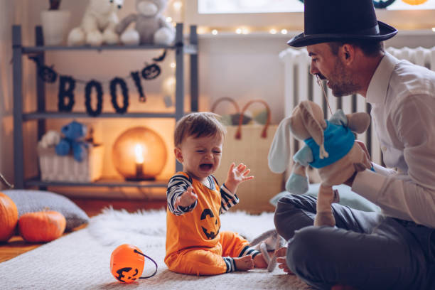 istock Father entertain baby to stop crying 1179435424