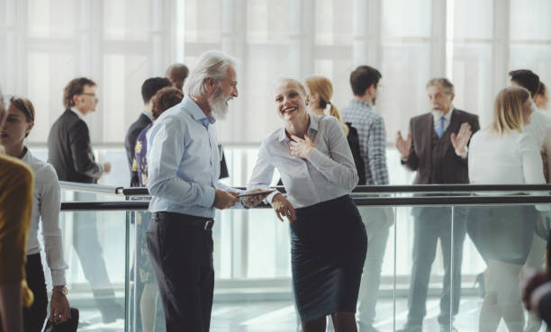 istock Business colleague talking in the office building lobby 1179435743